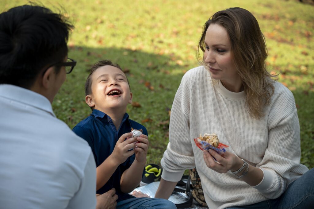 Parent and child enjoying time together outdoors, reflecting the stability and well-being supported by consistent child support arrangements.